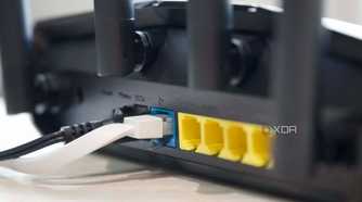 Asus RT-AX57 Ethernet ports and antennas from an angle