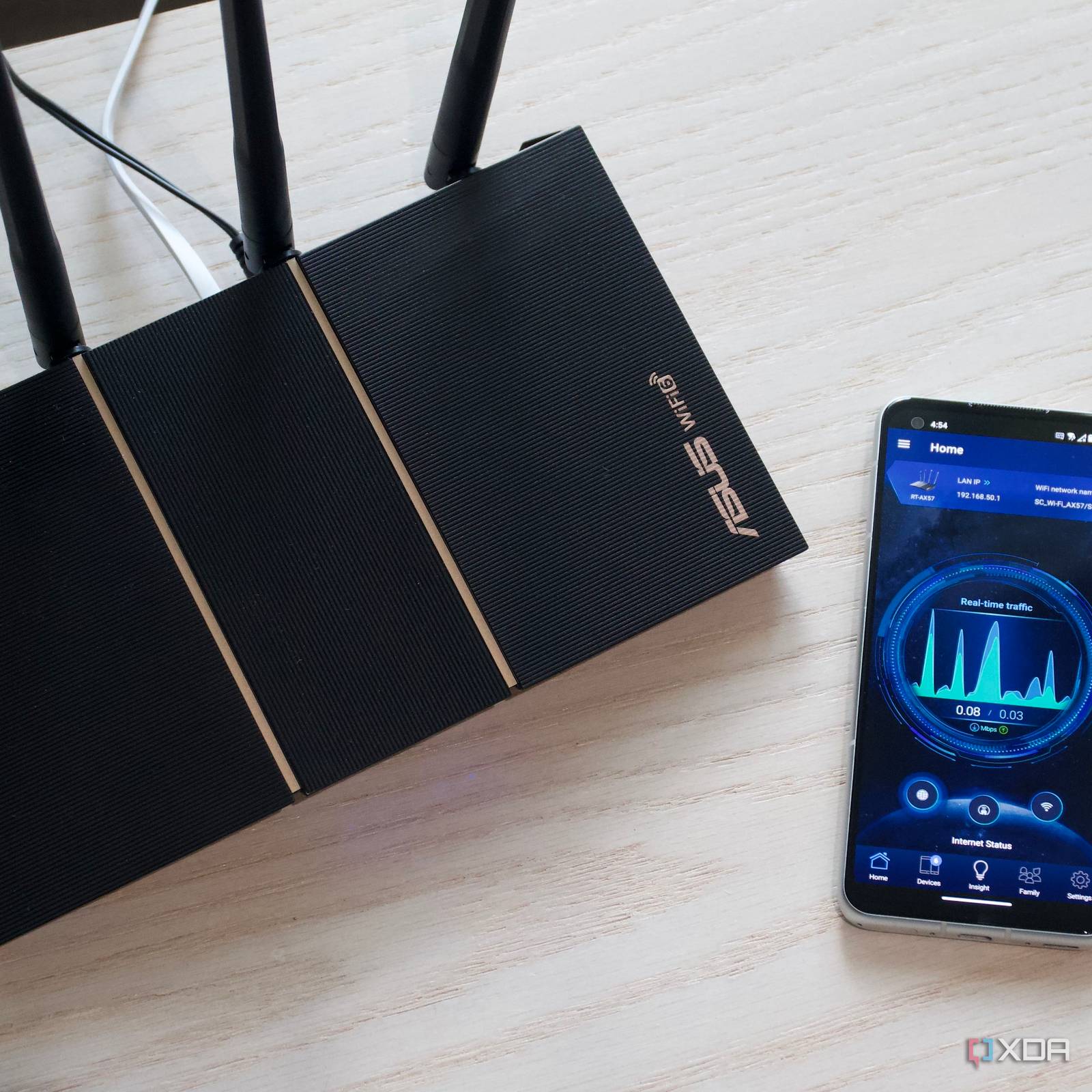 asus-rt-ax57-review-top-phone.