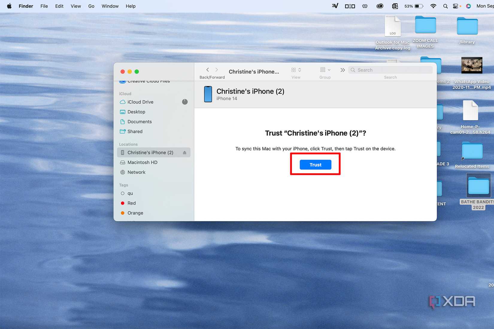 A Finder window on a MacBook asking to trust a connected iPhone and trusted selected.
