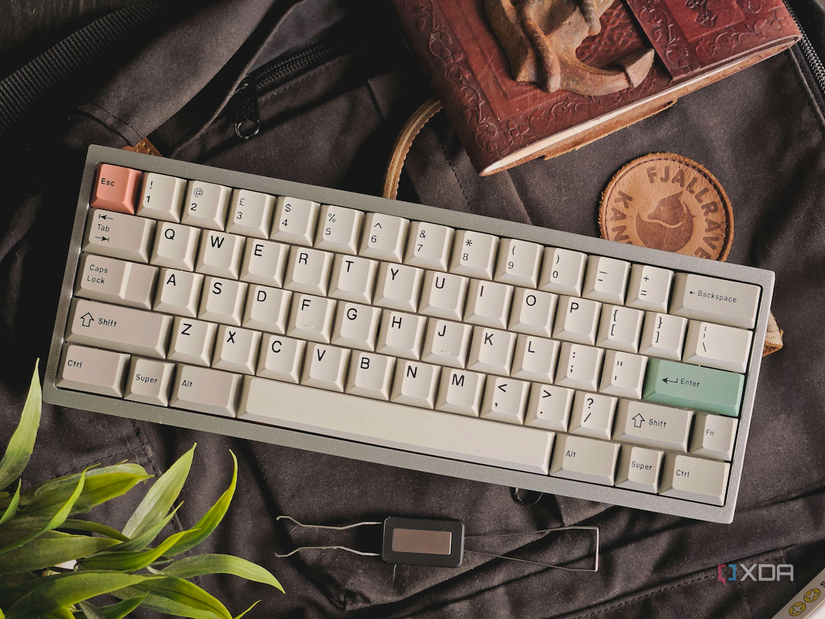 An image showing a custom mechanical keyboard with JTK keycaps on a bagpack.