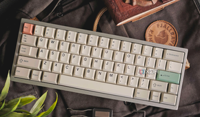 An image showing a custom mechanical keyboard with JTK keycaps on a bagpack.