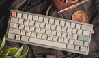 An image showing a custom mechanical keyboard with JTK keycaps on a bagpack.