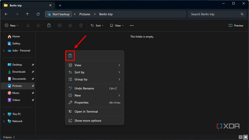 Screenshot of Windows 11 File Explorer with Paste button highlighted in the context menu