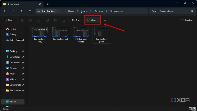 Screenshot of File Explorer in Windows 11 with the View button highlighted in the ribbon