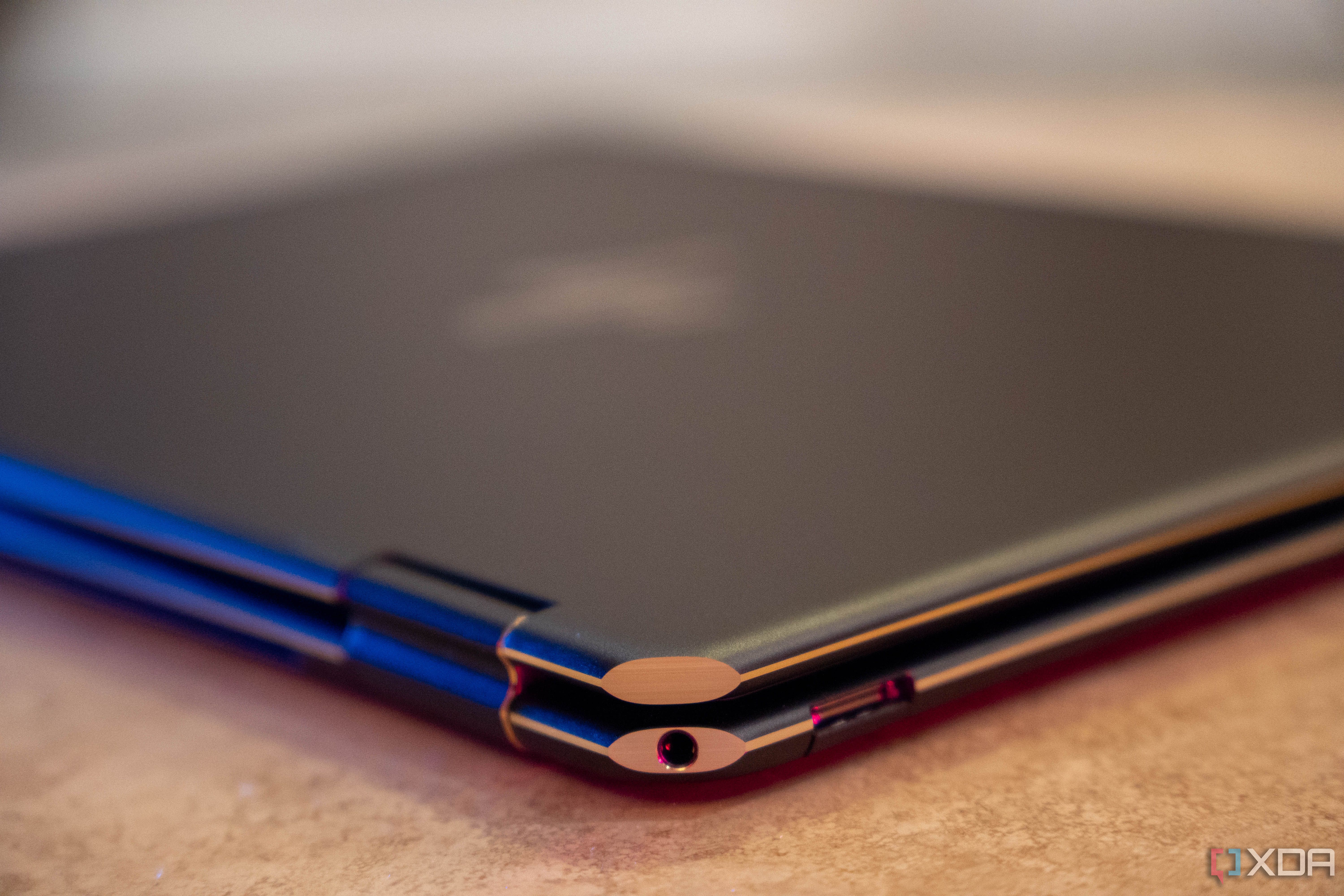 Corner of laptop showing a headphone jack