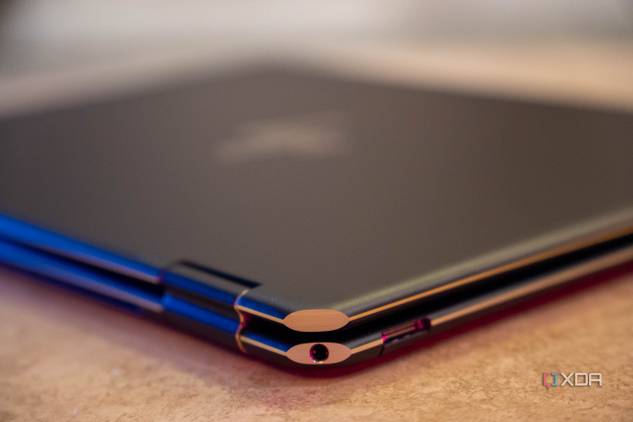 Corner of laptop showing a headphone jack