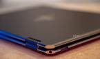 Corner of laptop showing a headphone jack