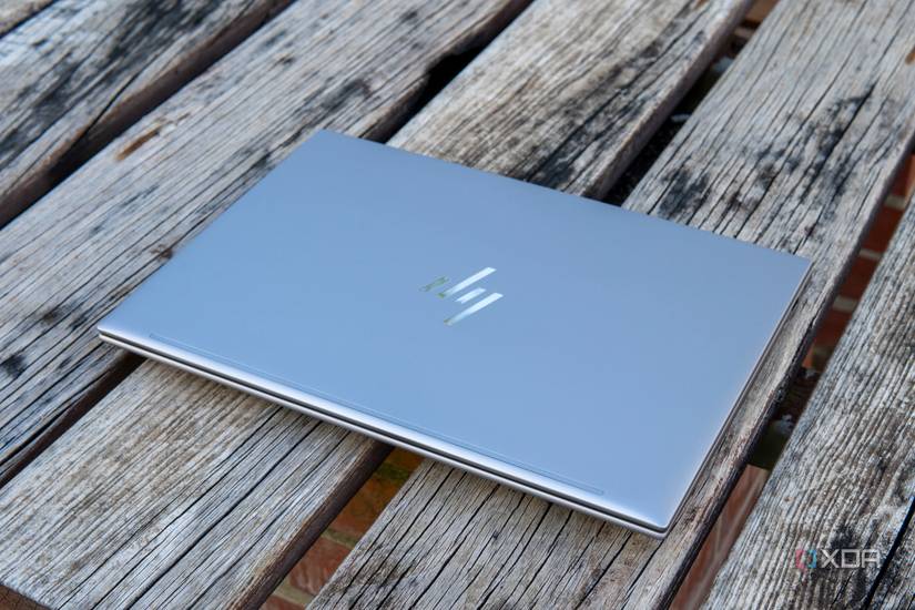 Angled view of the HP ZBook Firefly 14 G10 with the lid closed sitting on a wooden table.