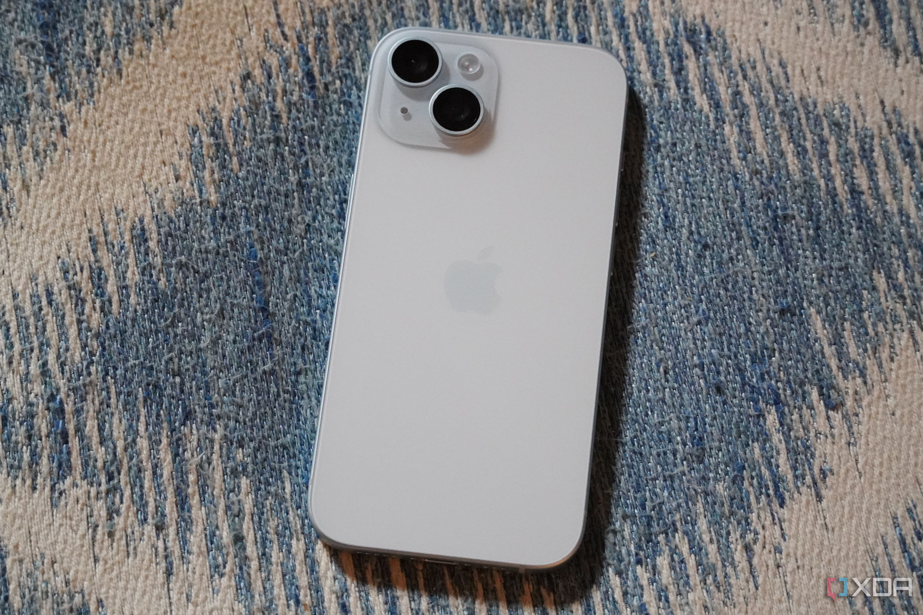 The back of a blue iPhone 15.
