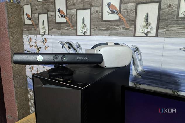 An Xbox 360 Kinect (V1) and a Meta Quest 2 placed on top of a PC