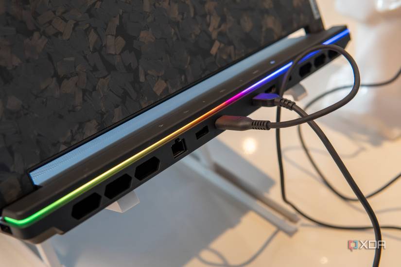 Closee-up view of the rear of the Lenovo Legion 9i with two cables connected to it.