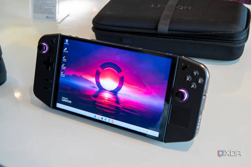 Angled front view of the Lenovo Legion Go handheld with showing a desktop background with pink and blue colors