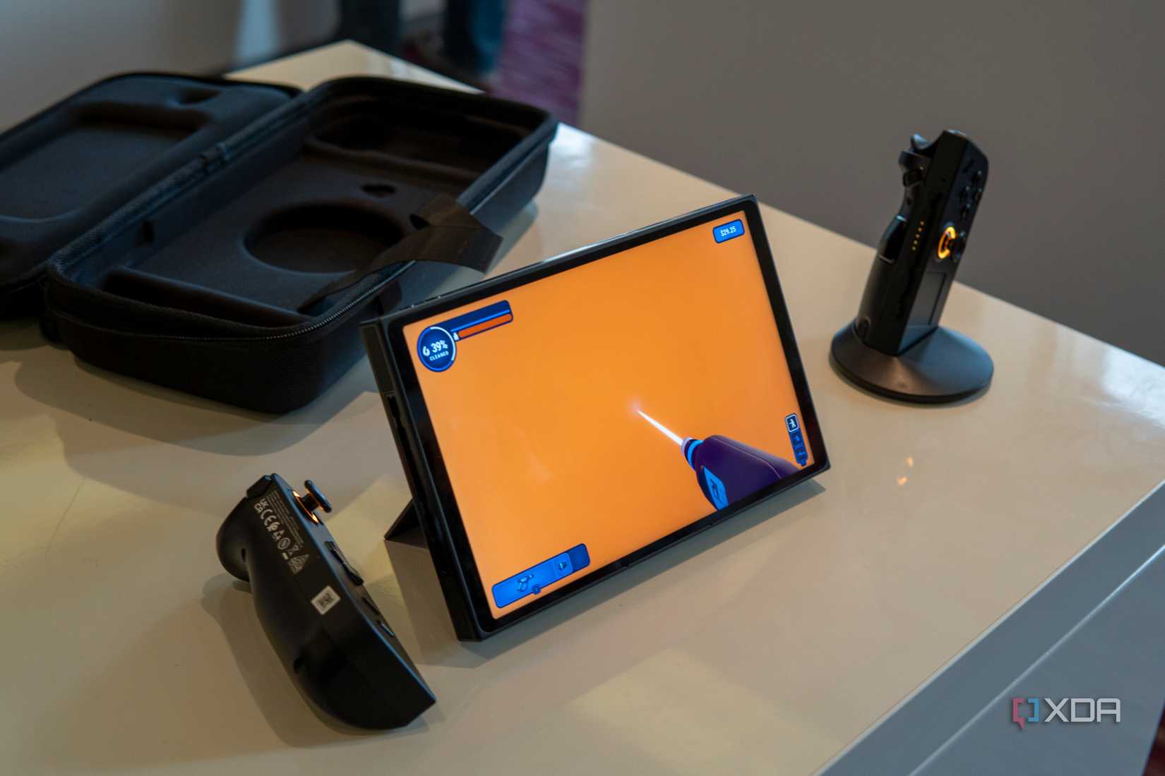A Lenovo Legon Go with the controllers detached and the right controller attached to the controller base to be used as a mouse