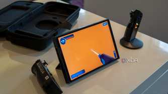 A Lenovo Legon Go with the controllers detached and the right controller attached to the controller base to be used as a mouse