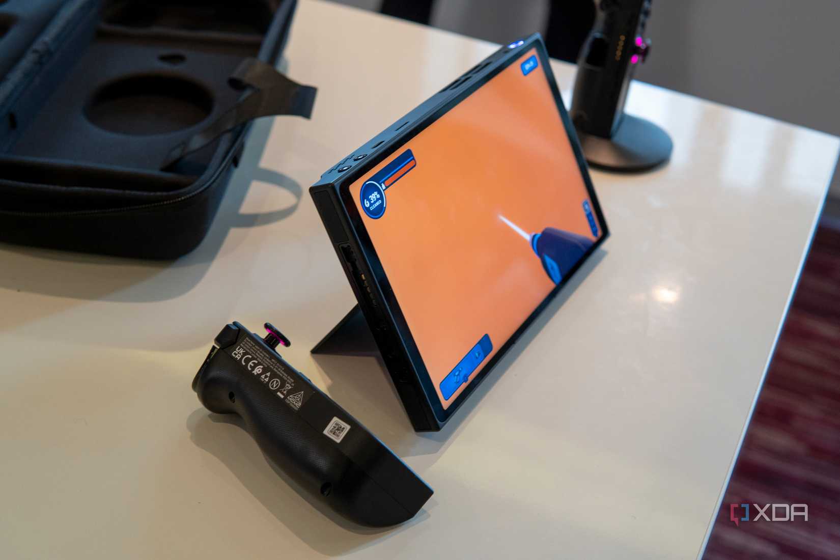 Angled view of the Lenovo legion Go with the controllers detached and the kickstand deployed