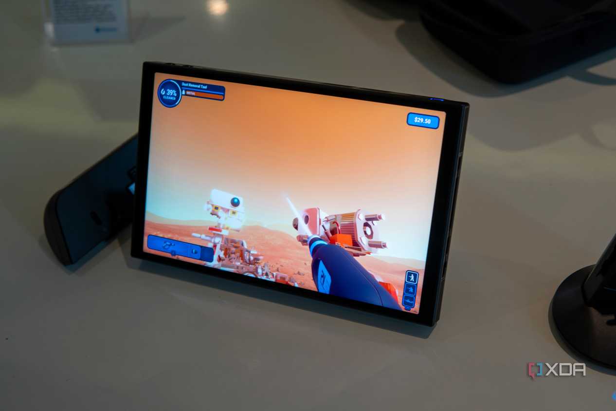 Angled view of the Lenovo Legion Go with controllers detached while plying Powerwash Simulator