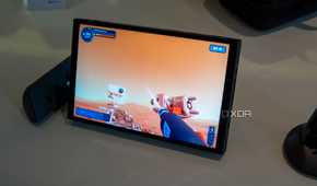 Angled view of the Lenovo Legion Go with controllers detached while plying Powerwash Simulator