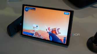 Angled view of the Lenovo Legion Go with controllers detached while plying Powerwash Simulator
