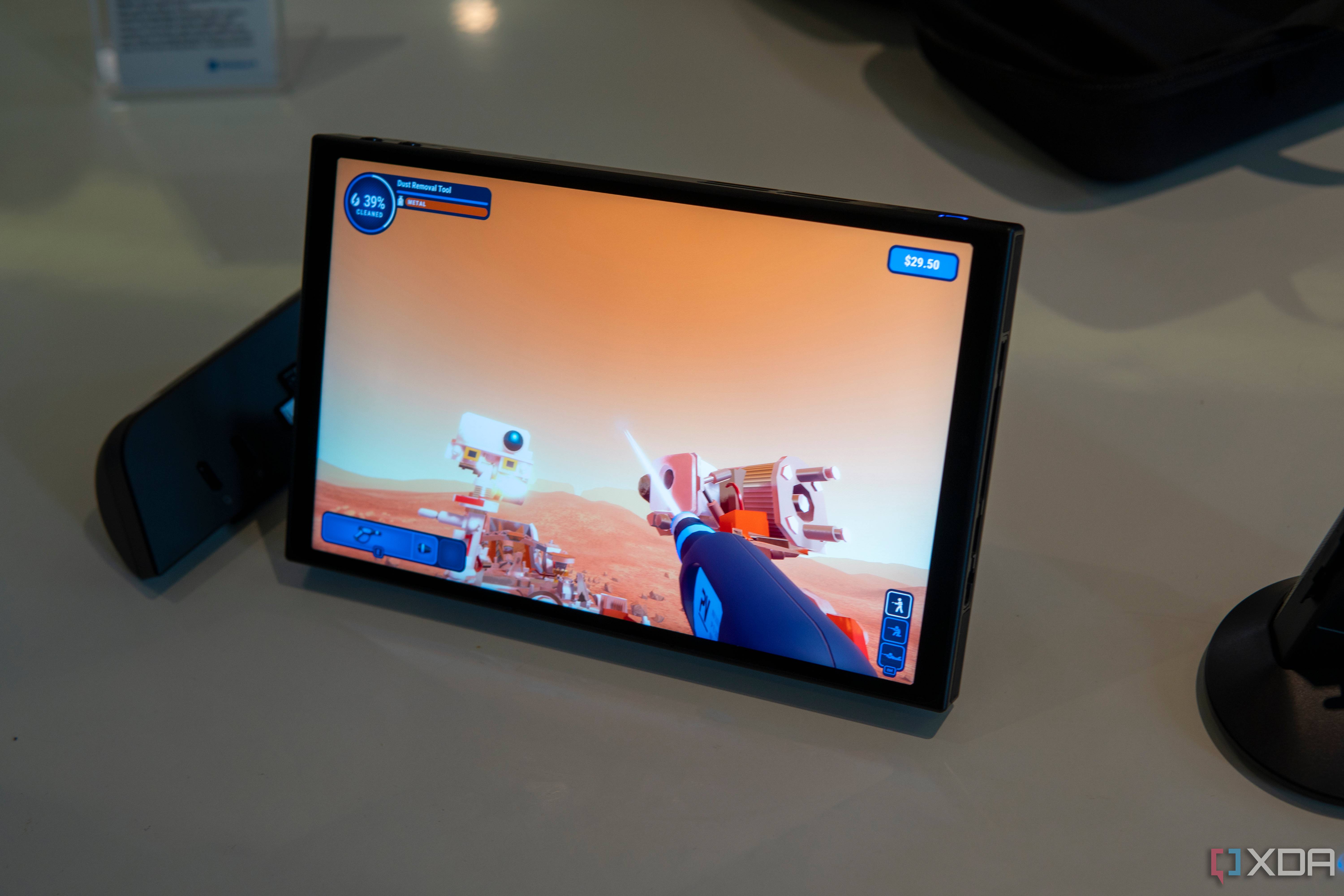 Angled view of the Lenovo Legion Go with controllers detached while plying Powerwash Simulator