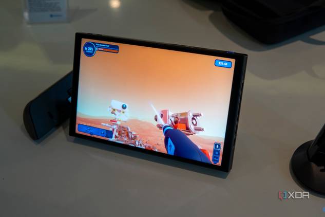 Angled view of the Lenovo Legion Go with controllers detached while plying Powerwash Simulator