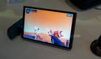 Angled view of the Lenovo Legion Go with controllers detached while plying Powerwash Simulator