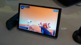 Angled view of the Lenovo Legion Go with controllers detached while plying Powerwash Simulator