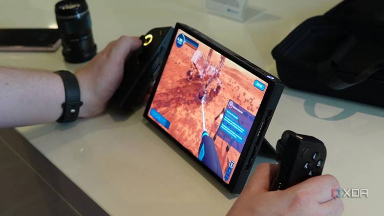 A Lenovo Legion Go with the controllers detached and the right controller being used in mouse mode
