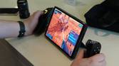 A Lenovo Legion Go with the controllers detached and the right controller being used in mouse mode