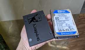An image of a Kingstone SSD kept adjacent to a WD hard drive.