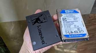 An image of a Kingstone SSD kept adjacent to a WD hard drive.