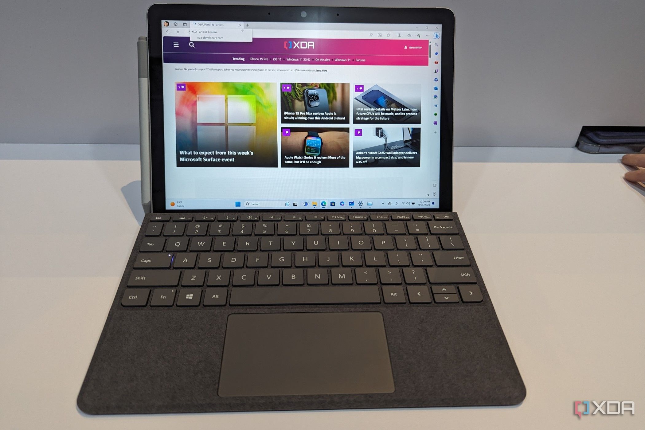 A Surface Go 4 displaying the XDA website.