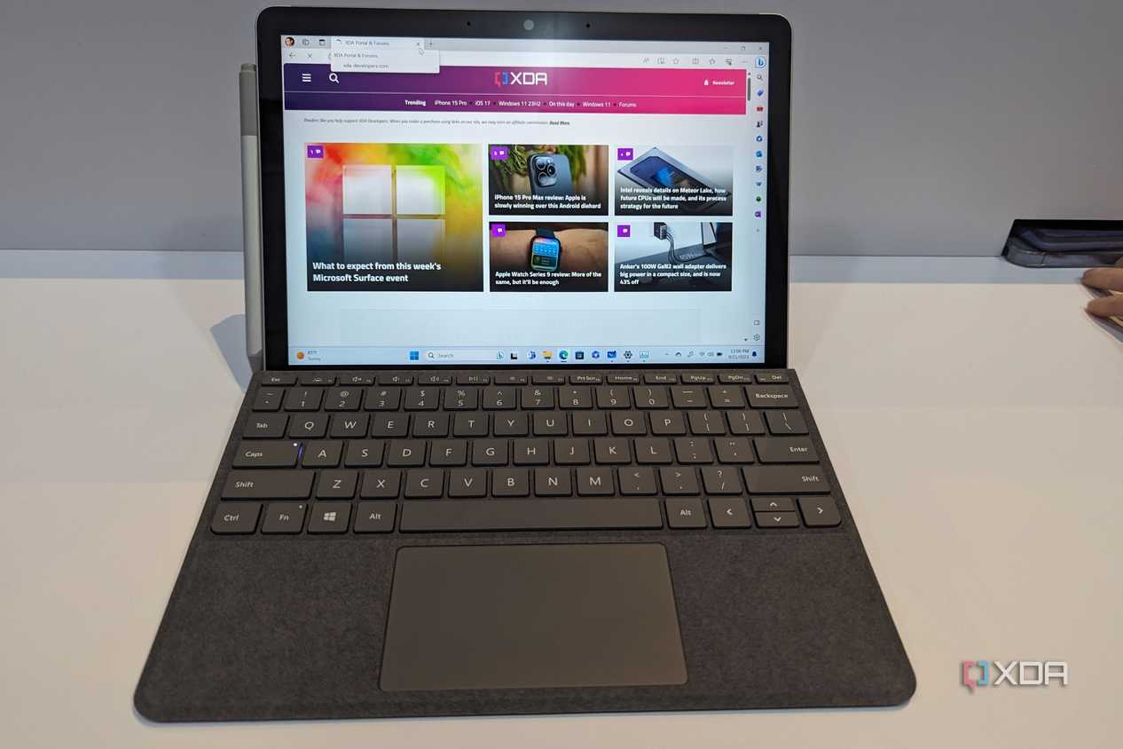 A Surface Go 4 displaying the XDA website.