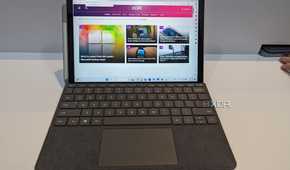 A Surface Go 4 displaying the XDA website.