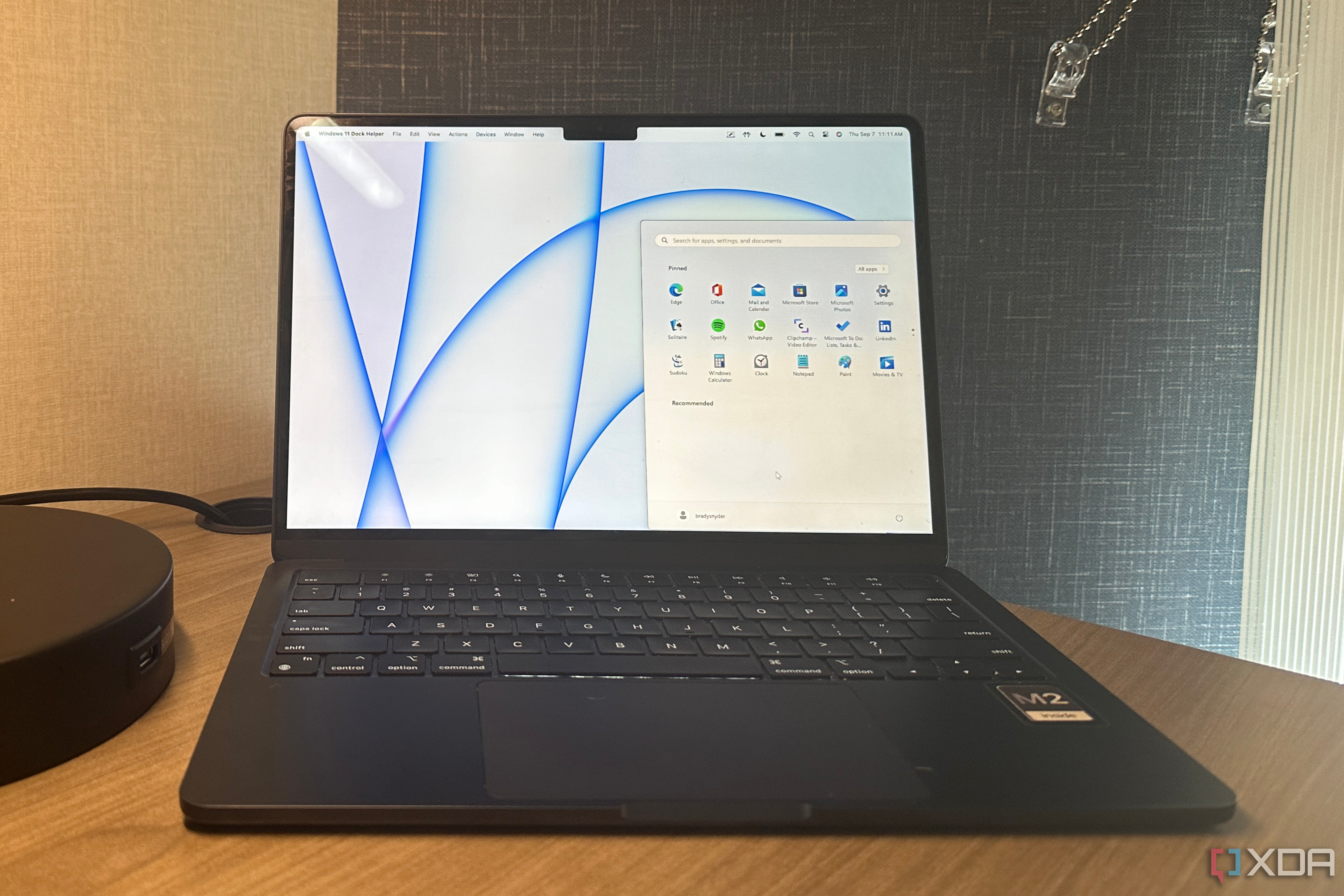 The Windows 11 start menu overtop the macOS desktop.