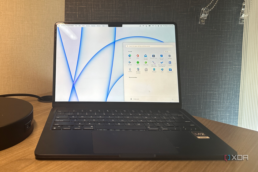 The Windows 11 start menu overtop the macOS desktop.