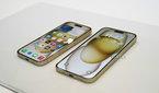 Apple iPhone 15 Pro and Pro Max side by side on mat.