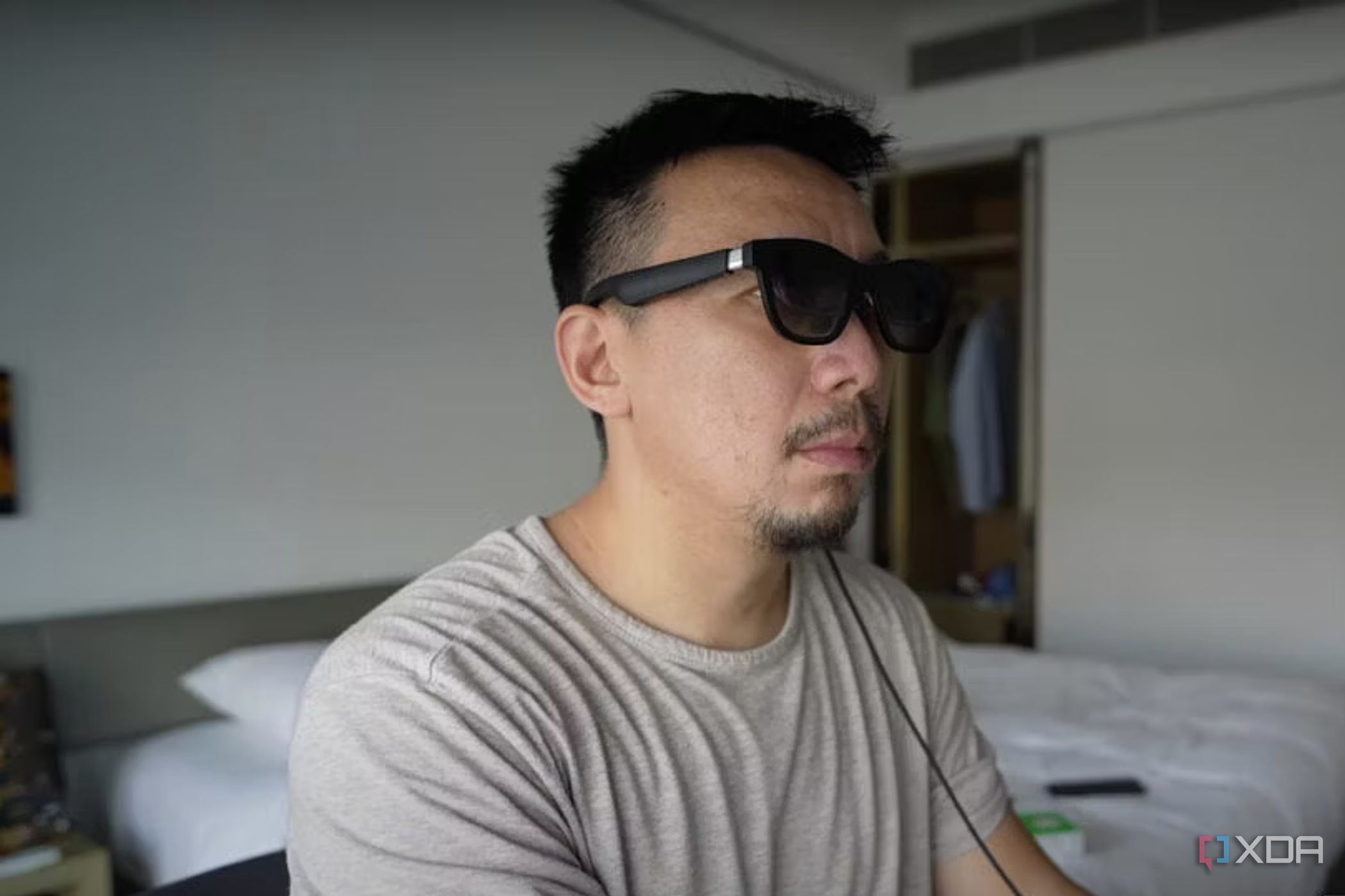 An image showing a person wearing XReal Air AR glasses.