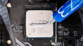 An photo showing an AMD Ryzen 5 3600 CPU with thermal paste.