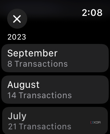 Apple Wallet app on Apple Watch showing transactions per month.