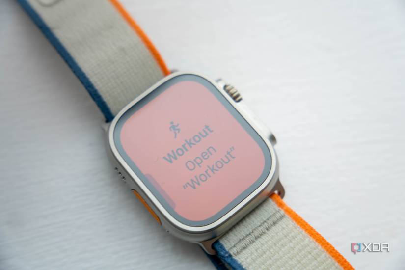 Apple Watch Ultra 2 showing Workout Open Workout text on orange background
