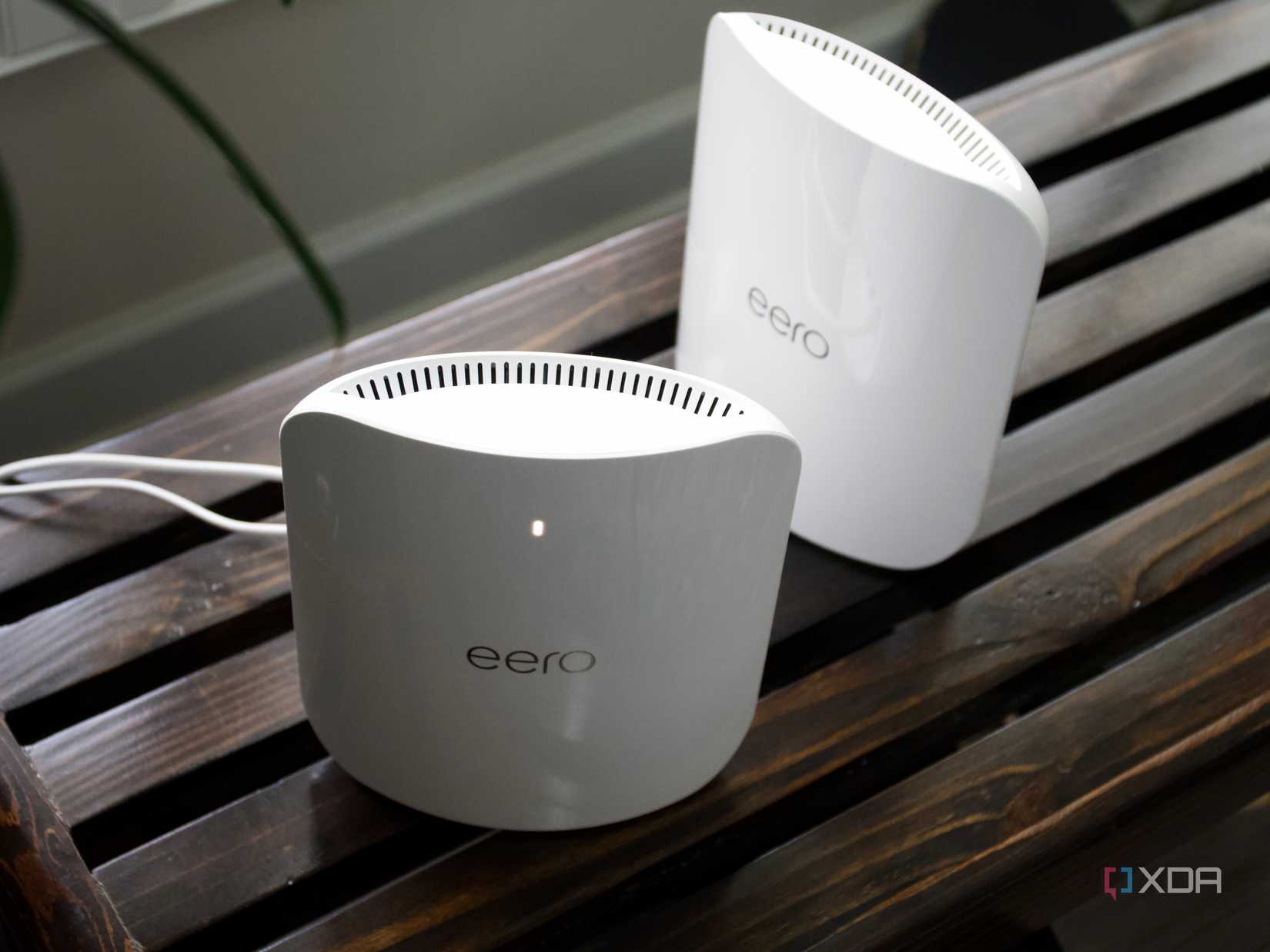Eero Max 7 nodes from above on a wooden bench