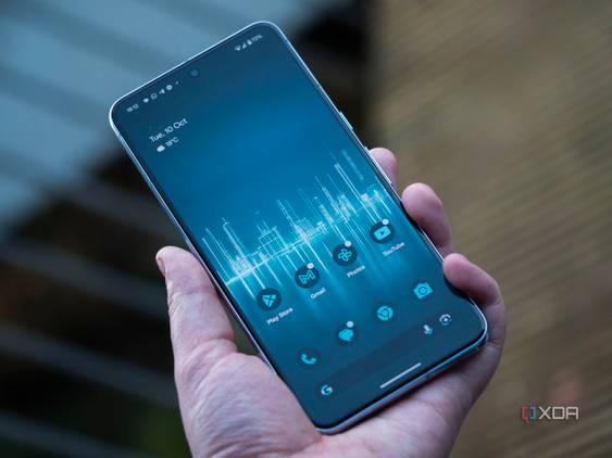 The Google Pixel 8 Pro in a hand open on the home screen