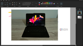 Screenshot of the Paint app in Windows 11 with a layer with a photo of a tablet open on a second layer