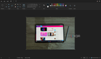 Screenshot of Paint with a picture of a tablet on top of a wooden surface
