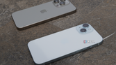 An iPhone 15 and iPhone 15 Pro Max on a tabletop.