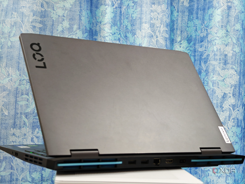 An image showing the Lenovo LOQ 15 laptop sitting on top of a PC case with its lid open.