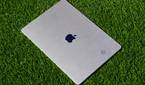The Starlight color of the MacBook Air (15-inch) on artificial grass.