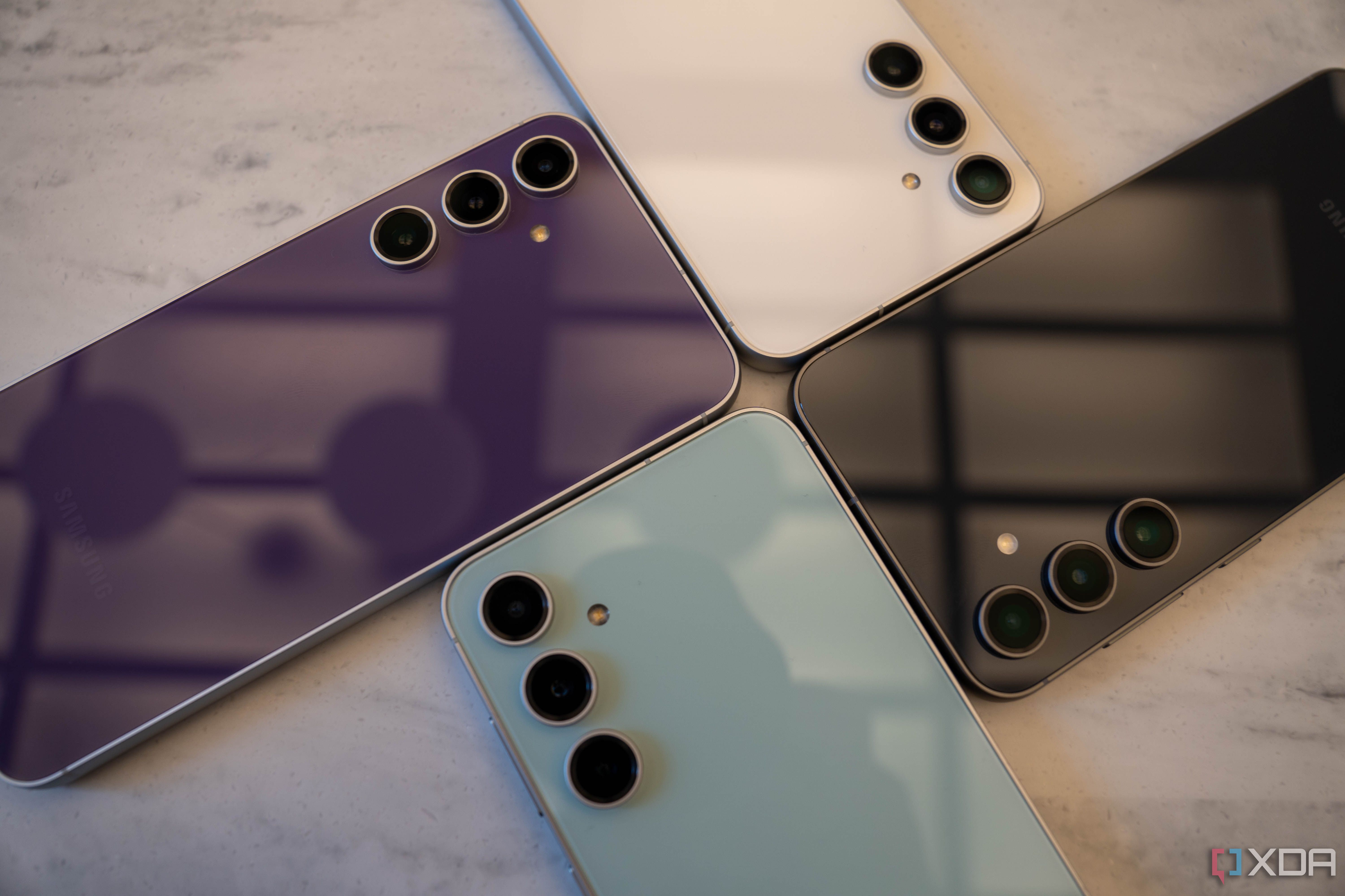 Four Samsung Galaxy S23 FE smartphones.