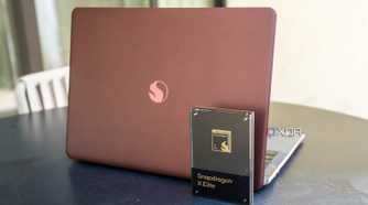 Snapdragon X Elite chip in front of a reference design laptop powered by the chip