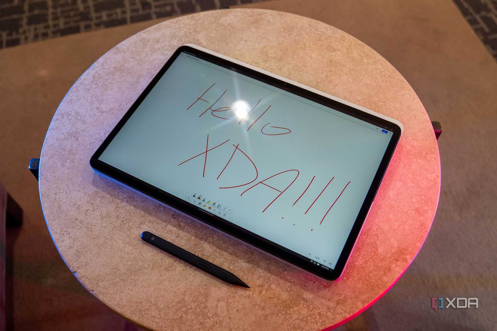 Surface Laptop Studio 2 with "Hello XDA!!!" on the screen